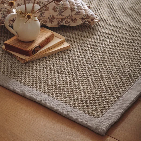 Chunky popcorn sisal rug with gray border.