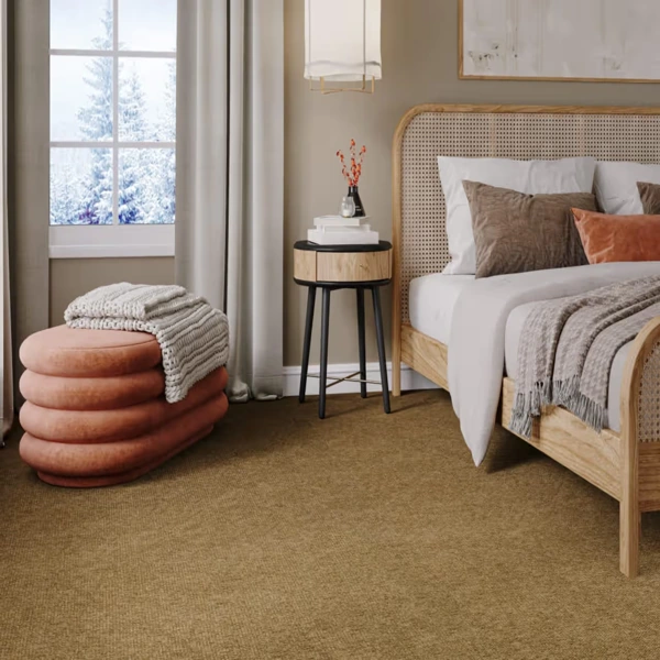 Tan bouclé sisal carpet in modern bedroom