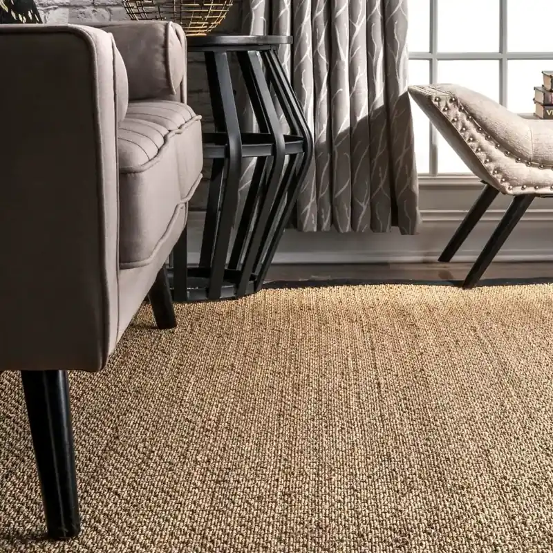 Close-up of textured jute rug under furniture
