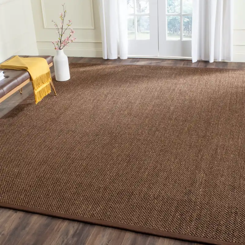 Large dark brown sisal rug on hardwood