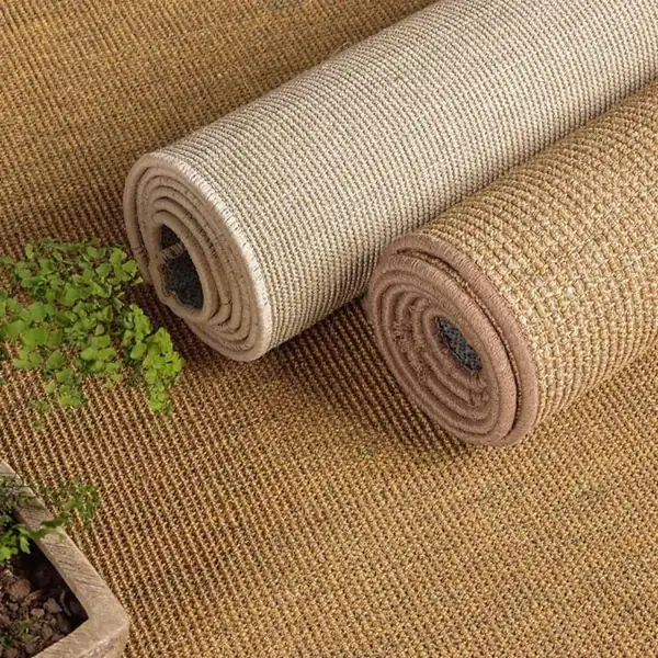 Rolls of textured beige sisal flooring